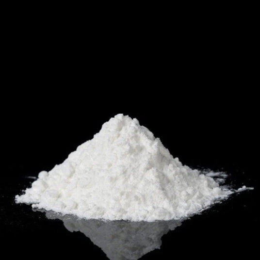 image of caffeine powder on black background